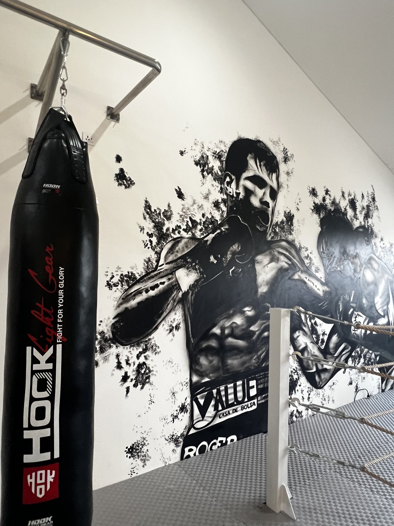 Heavy bag and fighter mural